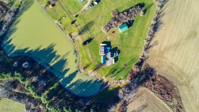 drone / aerial view with a rural view and a water view