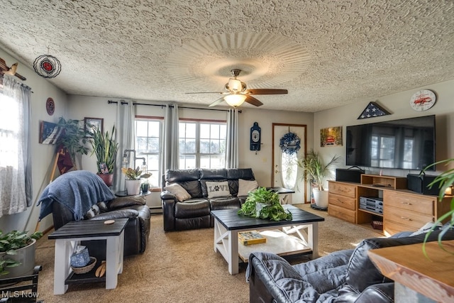 living room with carpet flooring, ceiling fan, and a healthy amount of sunlight