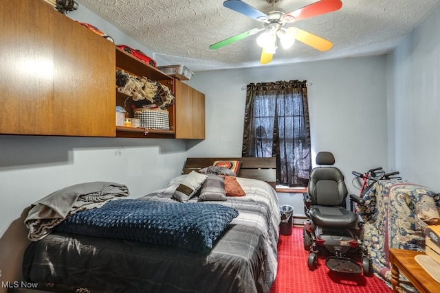 bedroom with a textured ceiling and ceiling fan