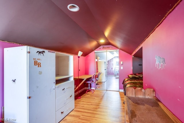 bonus room featuring light hardwood / wood-style flooring and vaulted ceiling