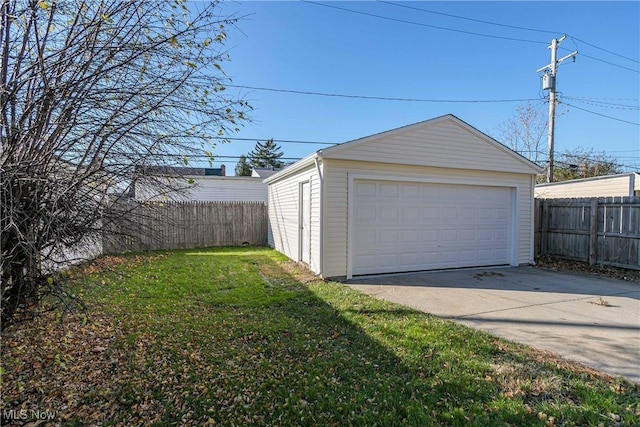 garage featuring a yard