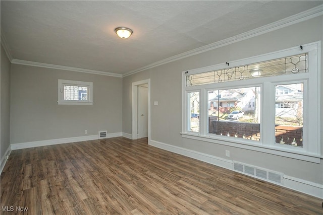 unfurnished room featuring crown molding and hardwood / wood-style floors