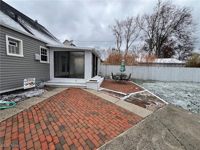 view of patio / terrace featuring a sunroom