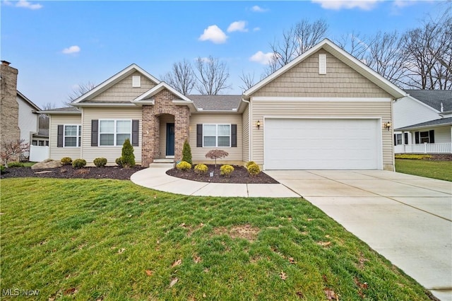 view of front facade with a garage and a front lawn