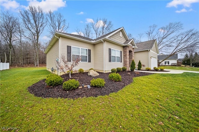 view of side of property with a lawn and a garage