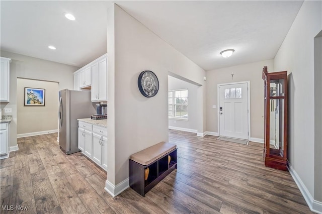 foyer entrance with light wood-type flooring