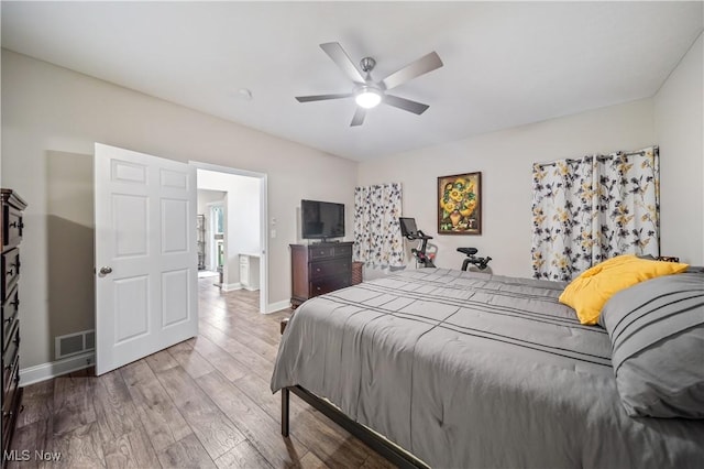 bedroom with ceiling fan and wood-type flooring