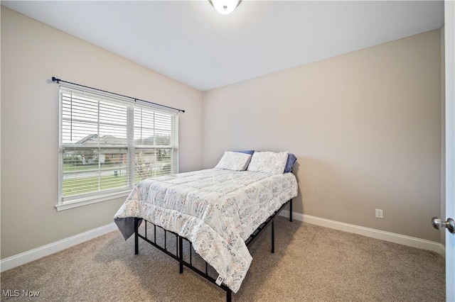 bedroom with light carpet