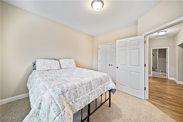 carpeted bedroom featuring a closet