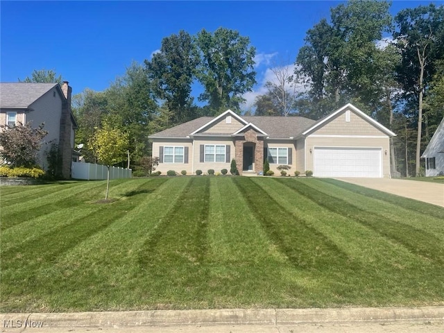 view of front of home featuring a front lawn and a garage