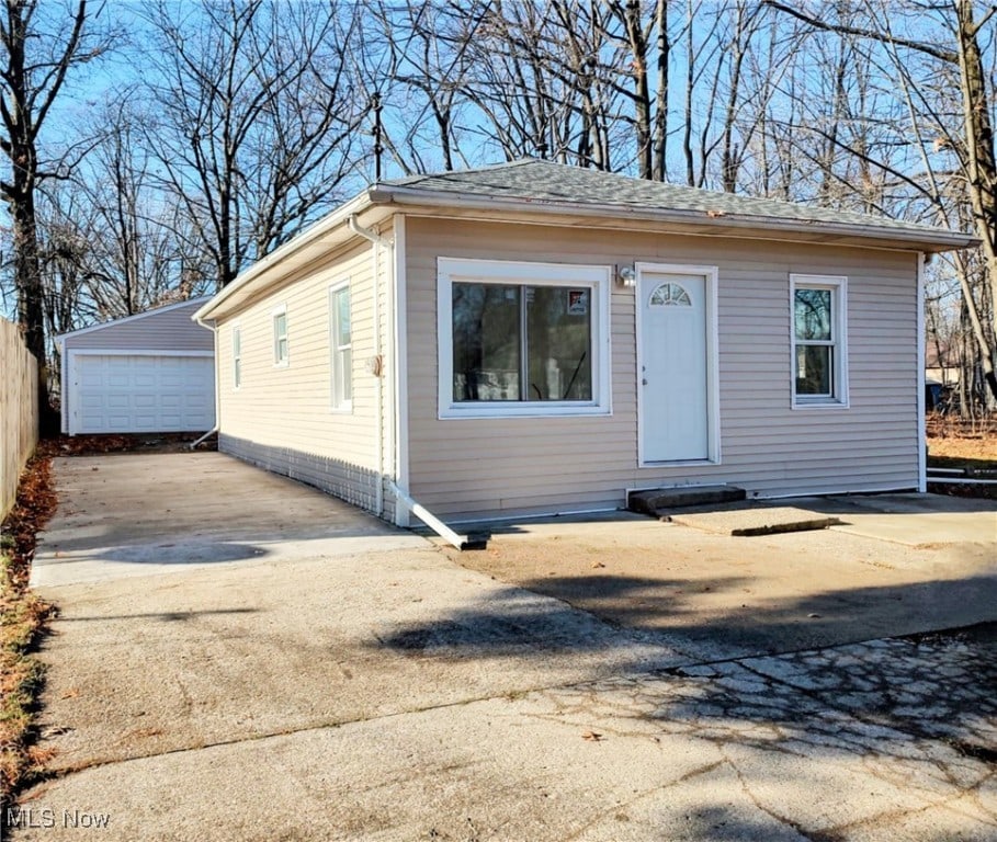 view of front of property featuring an outbuilding and a garage