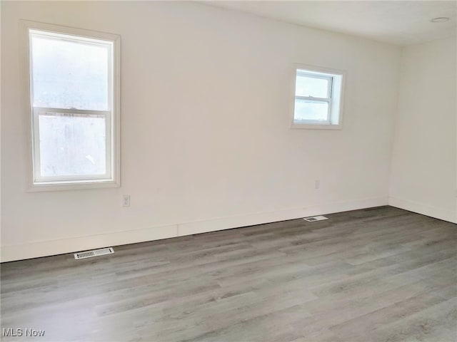 unfurnished room featuring wood-type flooring