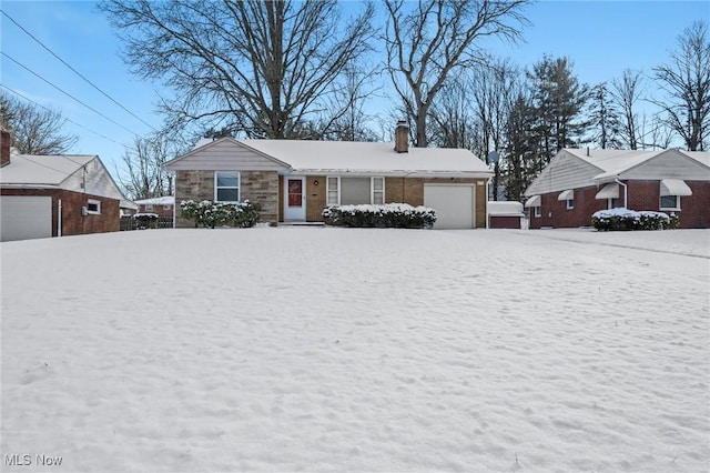 single story home with a garage