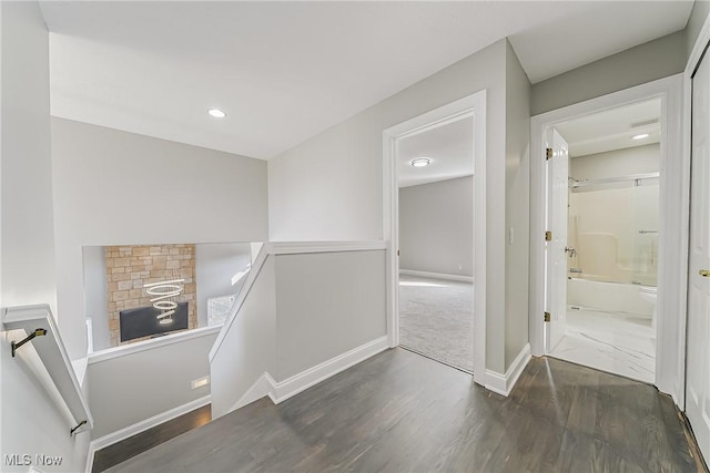 hallway featuring dark hardwood / wood-style flooring