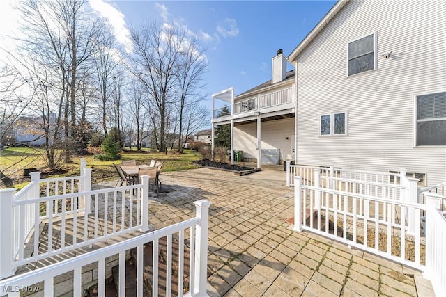 view of patio / terrace with a balcony