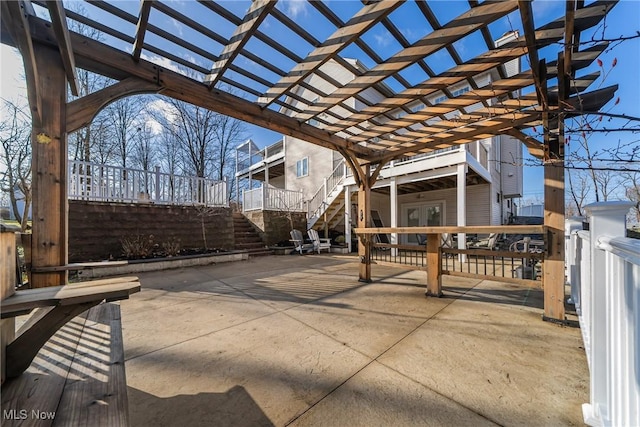 view of patio / terrace featuring french doors and a pergola