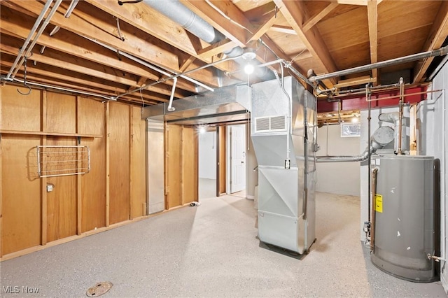 basement with heating unit and water heater