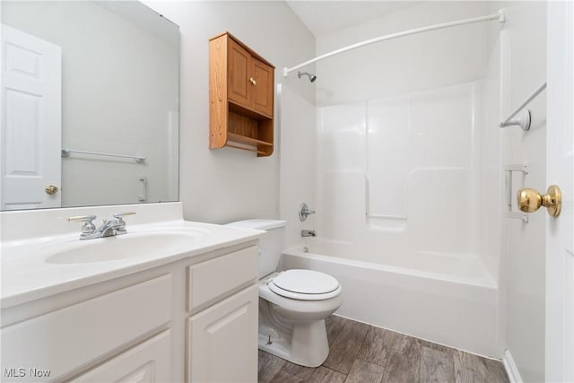 full bathroom featuring vanity, toilet, wood-type flooring, and shower / washtub combination