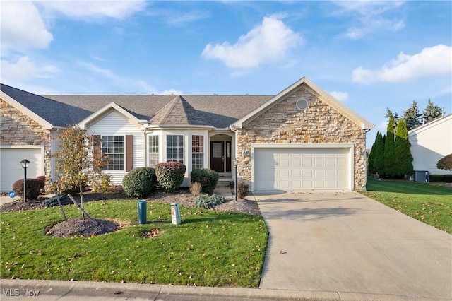 ranch-style home featuring a front lawn and a garage