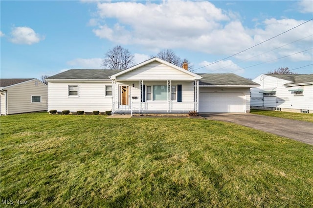 view of front of house featuring a front yard, a porch, and a garage