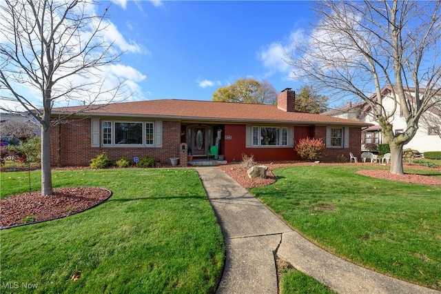 single story home featuring a front lawn