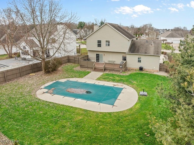 view of swimming pool with a lawn, a deck, a patio, and central AC