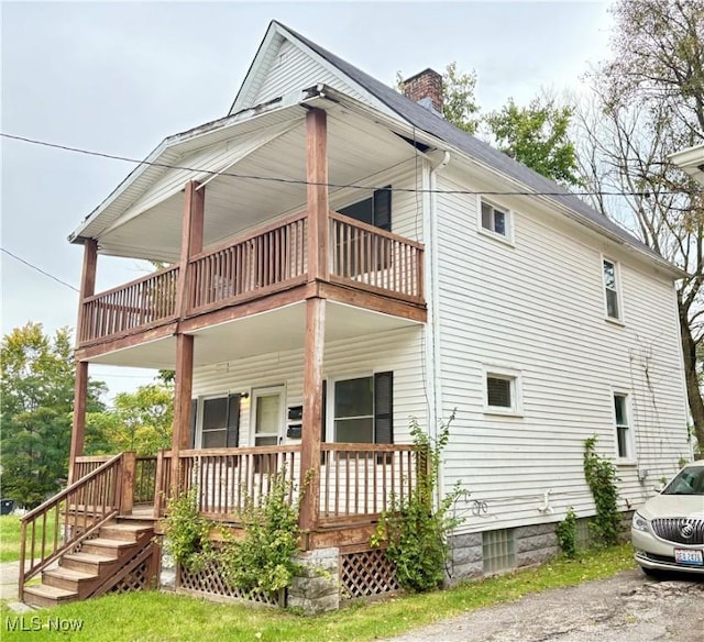 back of property featuring a porch