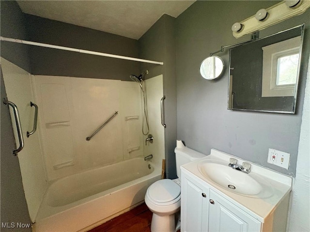 full bathroom with vanity, toilet, and washtub / shower combination