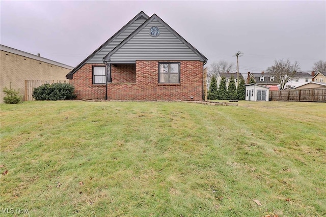 exterior space with a yard and a shed