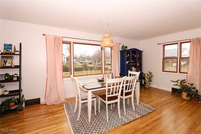 dining room featuring light hardwood / wood-style floors