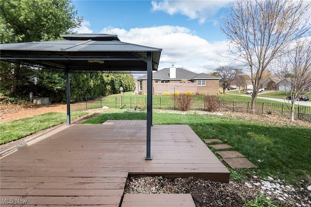 deck featuring a gazebo and a lawn