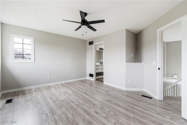 unfurnished bedroom with ceiling fan and light wood-type flooring