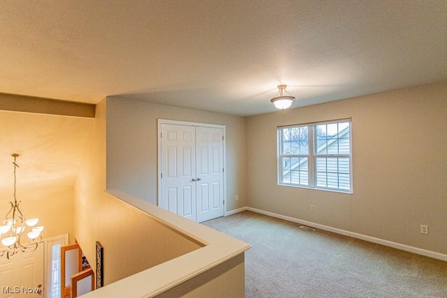 interior space with a closet and a notable chandelier