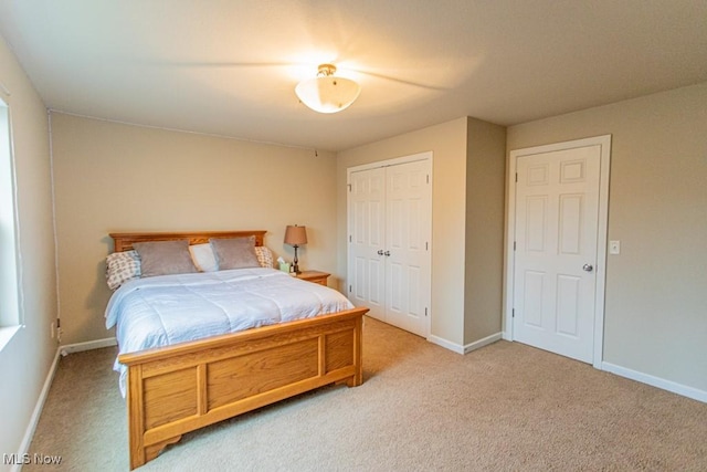 carpeted bedroom featuring a closet