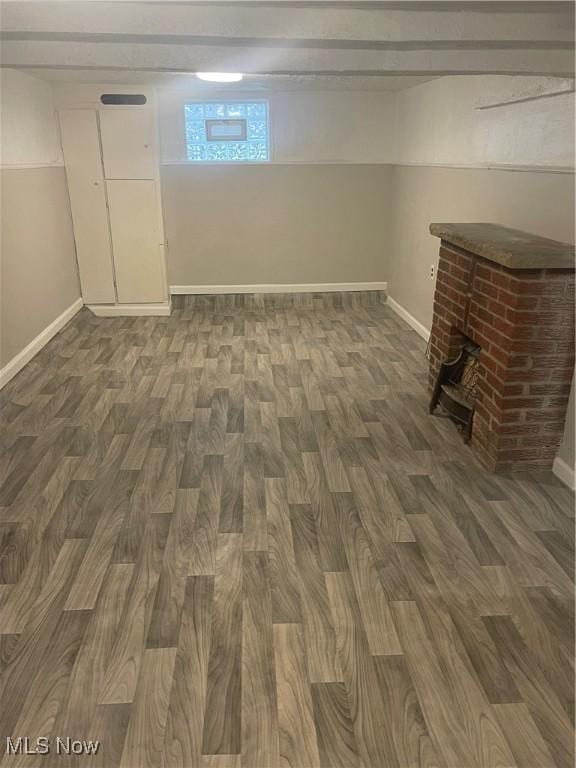 basement featuring dark hardwood / wood-style flooring