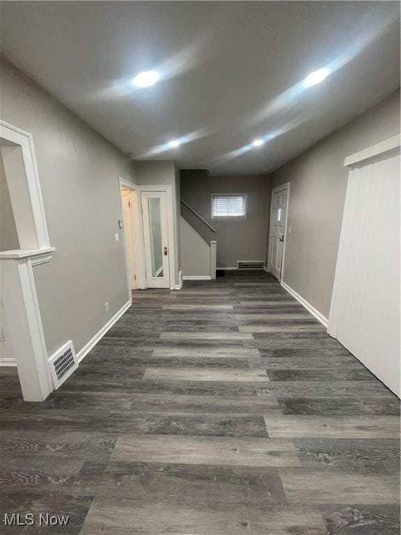 basement with dark wood-type flooring