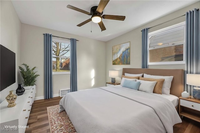 bedroom featuring ceiling fan and dark hardwood / wood-style flooring