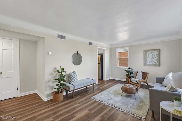 living room featuring dark hardwood / wood-style flooring