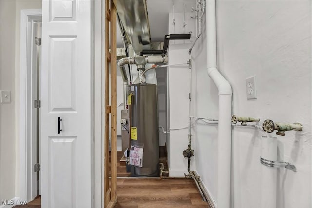 utility room featuring water heater