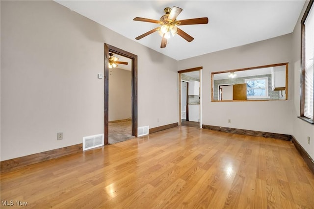 unfurnished room with light hardwood / wood-style flooring and ceiling fan