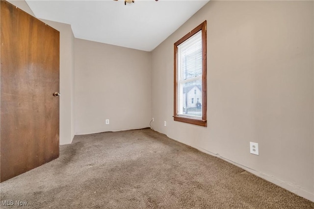 empty room with carpet flooring