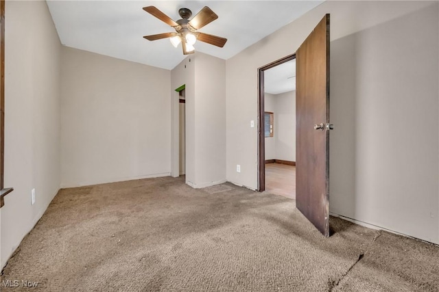 unfurnished room with ceiling fan and light colored carpet