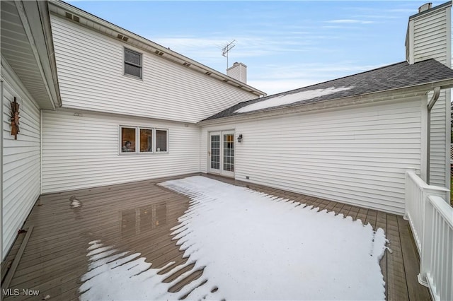 view of snow covered deck