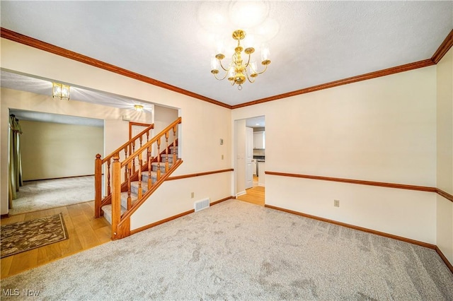 interior space featuring light colored carpet, ornamental molding, and a notable chandelier