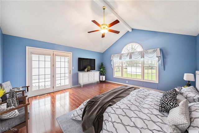 bedroom with ceiling fan, hardwood / wood-style floors, and lofted ceiling with beams