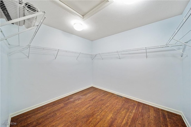 spacious closet featuring hardwood / wood-style floors