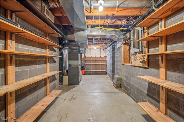 basement featuring heating unit