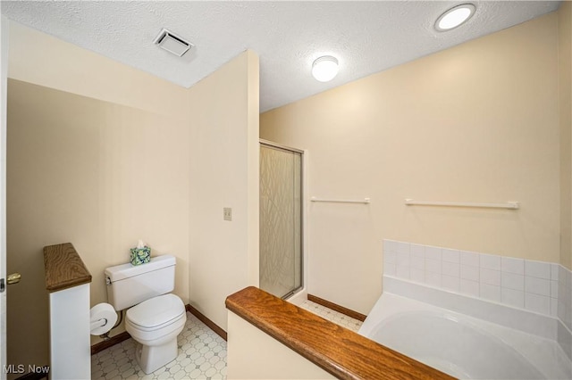 bathroom with shower with separate bathtub, a textured ceiling, and toilet