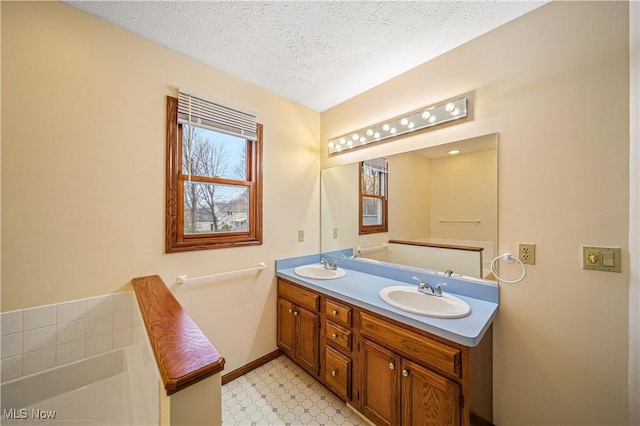 bathroom with vanity and a textured ceiling