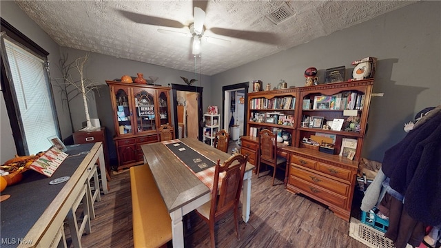 office featuring a textured ceiling, hardwood / wood-style flooring, and ceiling fan